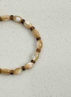 Grounded Radiance: Beige Trochus Shell & Golden Tiger Eye Protection Bracelet