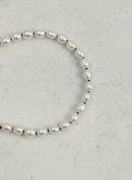 Luminous Purity: 5A Aurora Freshwater Pearl & Sterling Silver Healing Bracelet