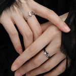 Eternal Paradox: Sterling Silver Dove & Raven Feather Garnet Couple Rings