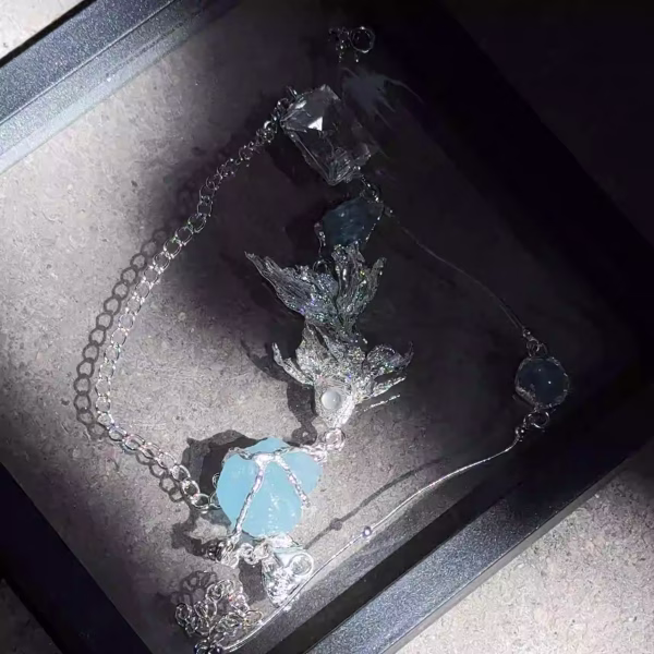Tranquil Flow: Natural Aquamarine & Sterling Silver "Swimming Fish" Healing Bracelet