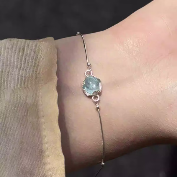 Tranquil Flow: Natural Aquamarine & Sterling Silver "Swimming Fish" Healing Bracelet