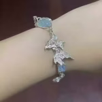 Tranquil Flow: Natural Aquamarine & Sterling Silver "Swimming Fish" Healing Bracelet