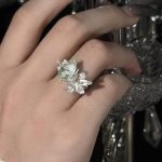 Ethereal Renewal: Sterling Silver & Peridot 'Lily in the Rainy Night' Adjustable Rings